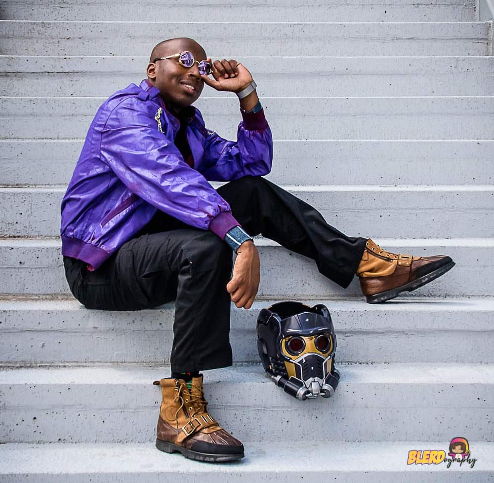 blerdography's tweet photo. Here a shot from this year's Black Geeks of DragonCon that's instantly became one of my fave cosplays of the con. 
Character: T'challa Star Lord 
Cosplayer: Micah Blair 
Photographer: Blerdography 
#dragoncon2021 #cosplay #blackgeeksofdragoncon #TChalla #TChallaStarlord #Marvel https://t.co/ZazXPs3nx5