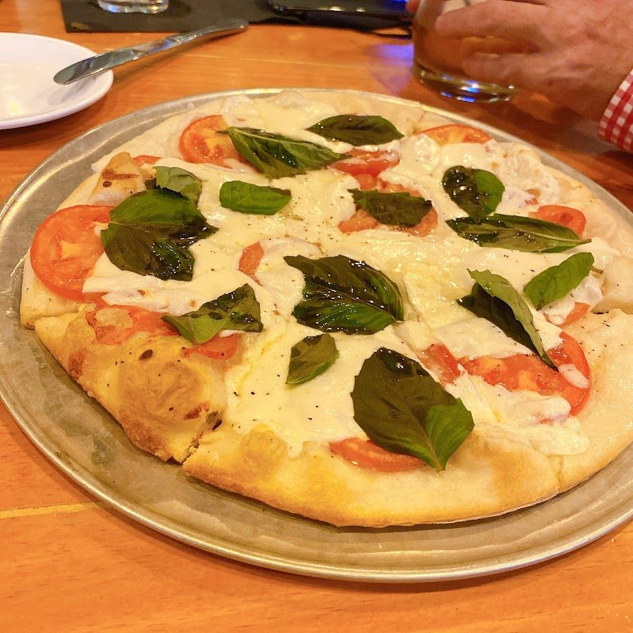 You can never go wrong with a classic Margherita Pizza and a cold beer. 🍕🍺 View the full pizza list at buff.ly/3lc8ncz. 

#RaleighNC #Raleigh #Pizza #Beer #RaleighFoodPics