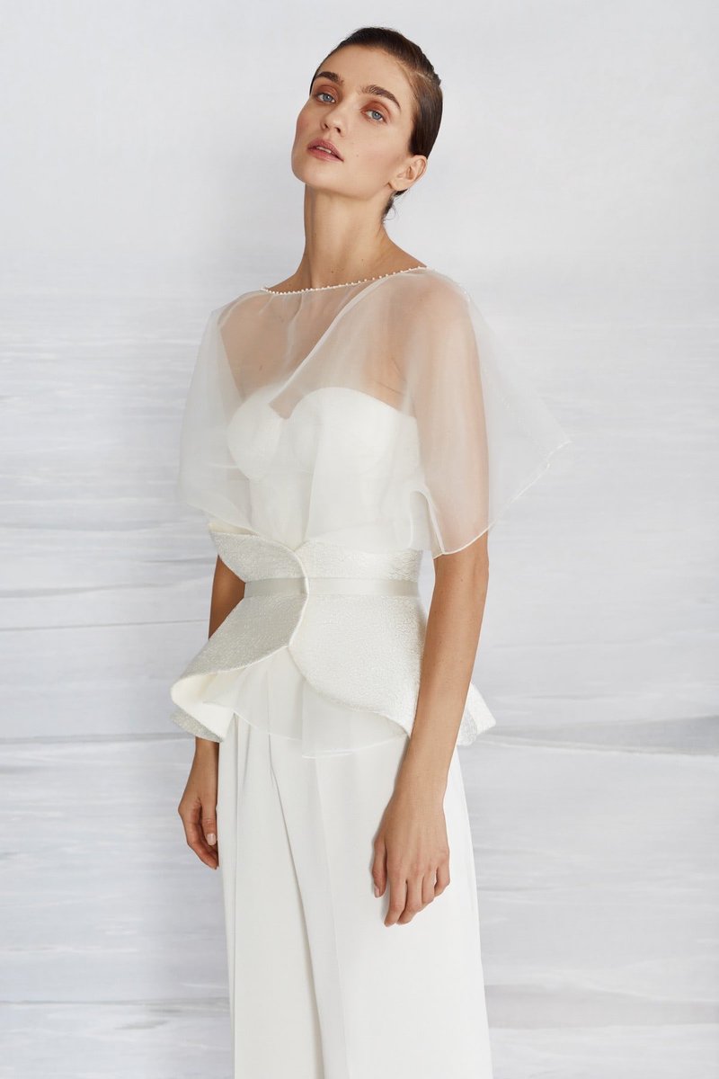 Gem | 18072
Deep water collection by #liretta

A wedding pantsuit with lace corset and peplum belt. Paired with the transparent organza blouze. 

pollardi.com/catalog/lirett…
#wedding #weddingday #weddingdress
