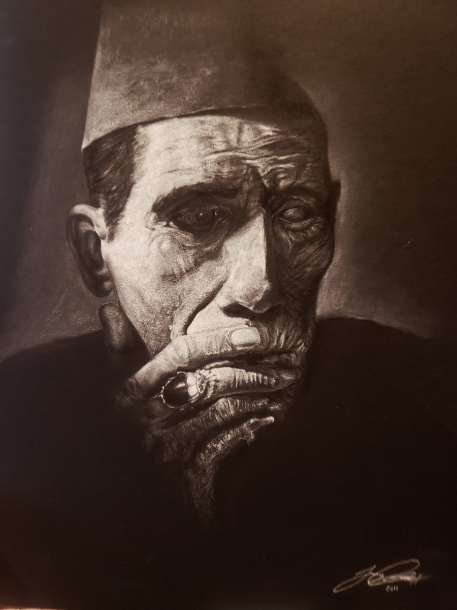 My white charcoal on black matboard.