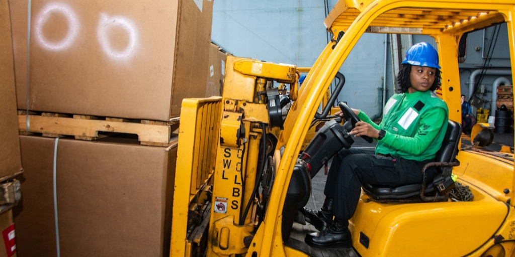 Navy Petty Officer 2nd Class Gia Woodcox moves mail aboard the aircraft carrier USS Ronald Reagan during a replenishment-at-sea in the Philippine Sea ow.ly/Nqcq50GmX4e