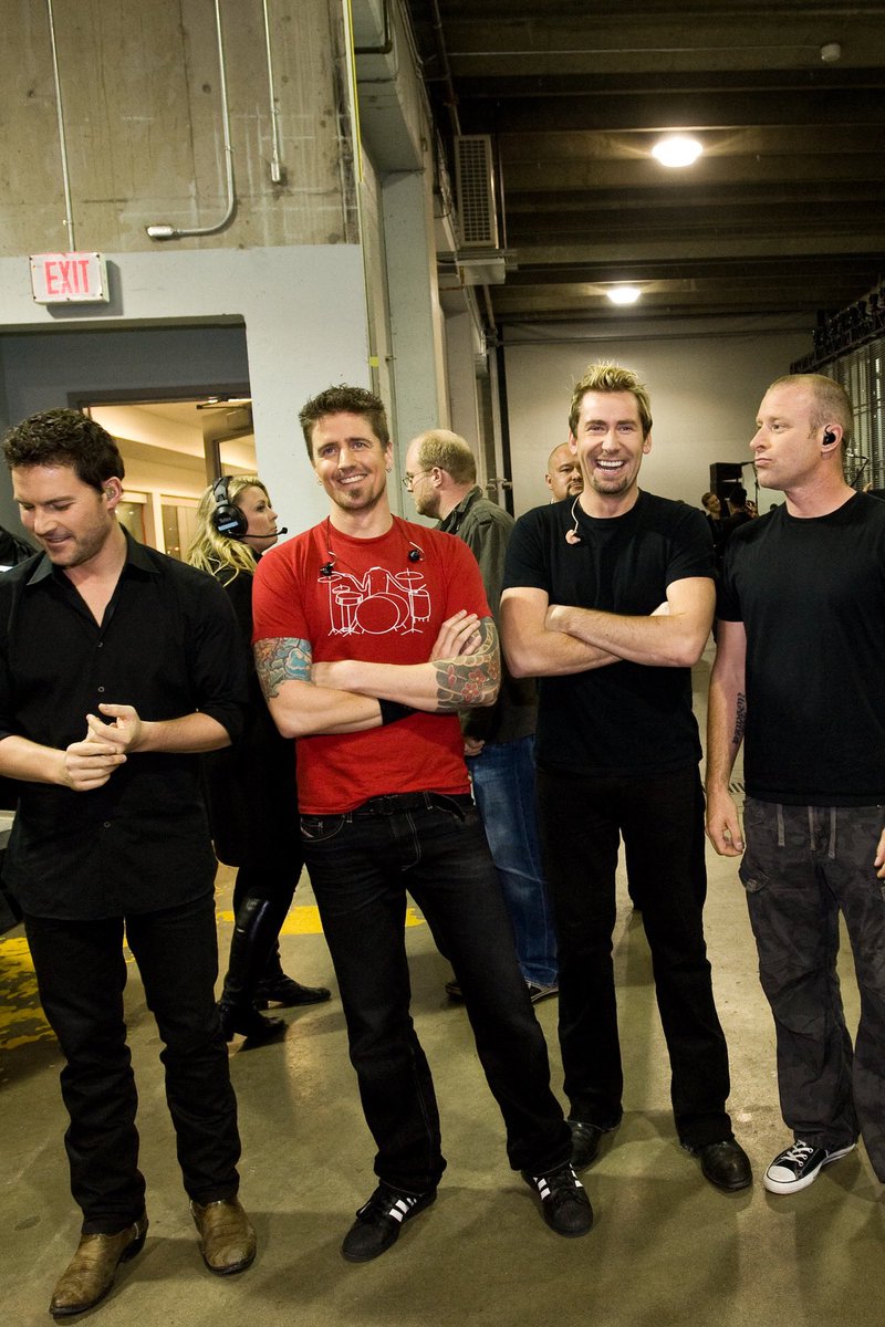Nickelback's tweet photo. When someone disregards the dress-code memo and wears red on “black t-shirt day”… #TBT https://t.co/IdOWV77NDt