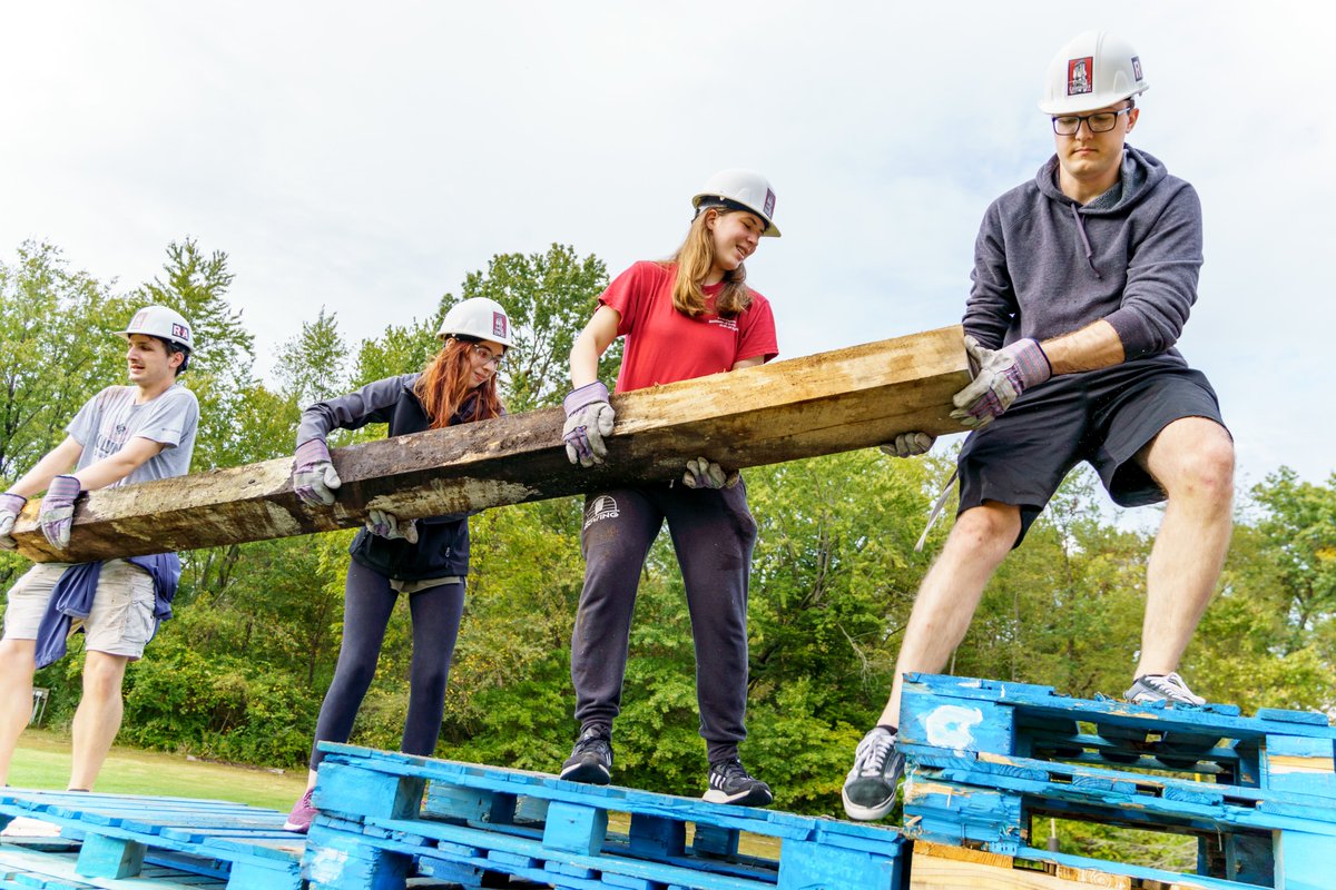 RoseHulman's tweet photo. The ties that bind . . . First-year students are continuing the tradition of building the Homecoming bonfire. It will be set ablaze after Friday night's pep rally. It is great to see students working together to reaffirm our unique campus community. #rosehulman https://t.co/LHXfgxtiPZ