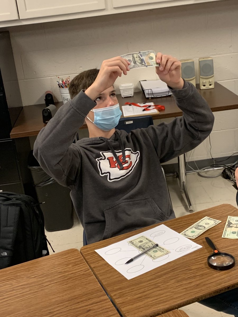 CMSsocialst8's tweet photo. Is it real? Students examine  lots of cash in the classroom! What a fun and engaging way to look for features used to prevent counterfeiting. #CardinalPride ⁦@CMSCardinals⁩ ⁦@ClintonMoCards⁩ https://t.co/khG6vbBNzq