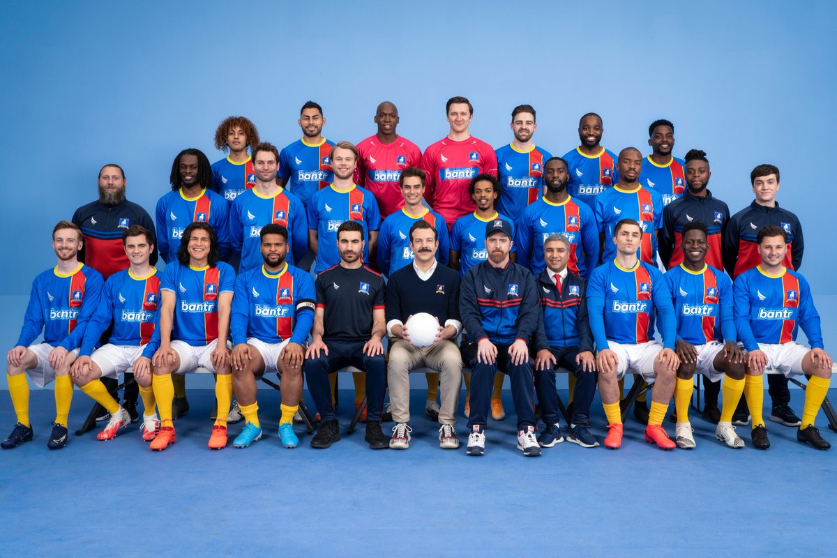brettgoldstein's tweet photo. It all comes down to this… the Ted Lasso Season Finale… Written by the great men themselves, @jasonsudeikis and @joekellyjk47. No spoilers but judging by these photos, Roy gets ‘Witch’s Finger’ in charades, the team has a class photo and Higgins shows off his puppies. #tedlasso https://t.co/xzwHr3mHfa