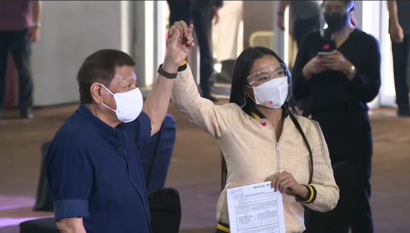 ANCALERTS's tweet photo. LOOK: President Duterte raises the hand of Mocha Uson, who is a nominee of the Mothers for Change (MOCHA) party-list. #Halalan2022 https://t.co/GKYtY0aYjf
