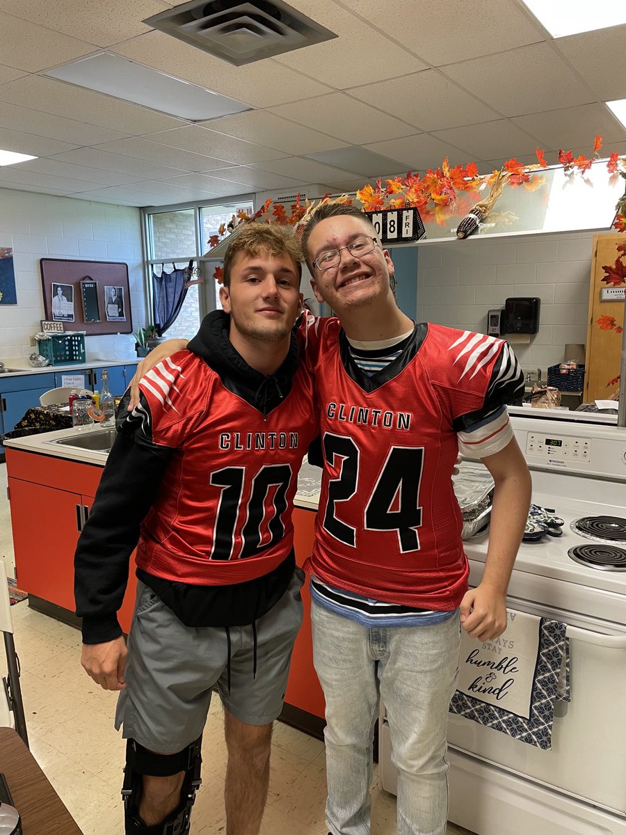 Our man Carson with Captain George Ames sporting a varsity football jersey.
