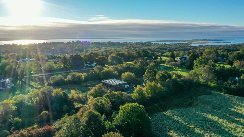 NPTRE's tweet photo. Exciting news from our #sachuestbuild. The solar PV has been installed on the roof! These awesome drone shots were captured by ri.aerials #droneshot #residentialsolar #netzerohome https://t.co/oIhxjexeah