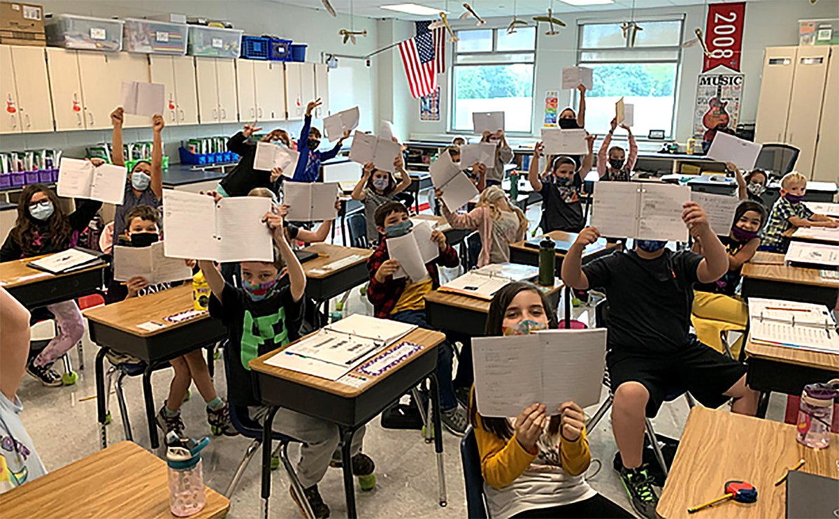 3rd grade students <a href="/TawankaEagles/">Tawanka Elementary Eagles</a> proudly holding up their math journals after recording multiplication findings!