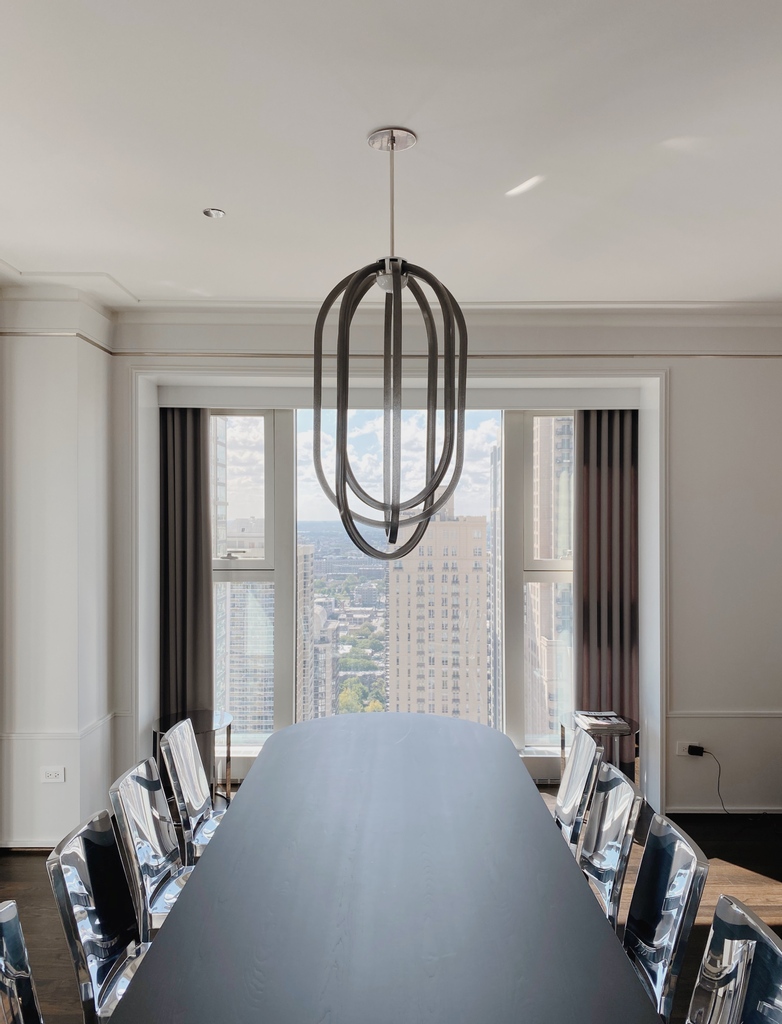 coilanddrift's tweet photo. A CIRRUS Chandelier in polished chrome with custom grey tinted rings just installed in an in-process Chicago project by @karamann. https://t.co/vLO7baFI8U