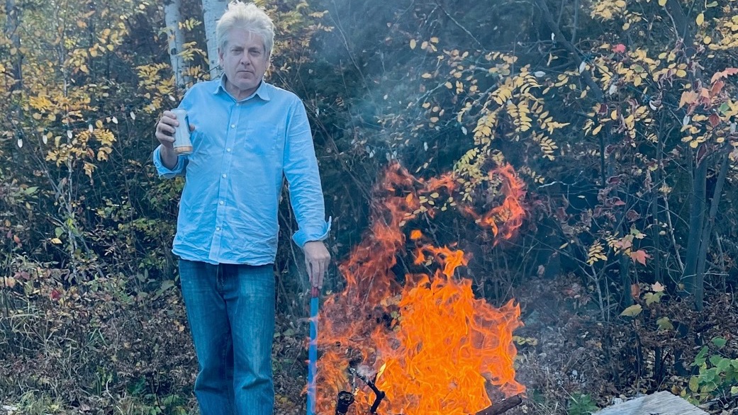 CharlieAngusNDP's tweet photo. Thanksgiving Friday 
Mileage 104 
Northern Ontario. 
After a long week in Ottawa I'm out at the fire pit with a perfect soundtrack.
"We drove 800 miles without seeing a cop 
got rocknroll music blasting off the t-top."
Stay safe. https://t.co/6znGMwrUfn