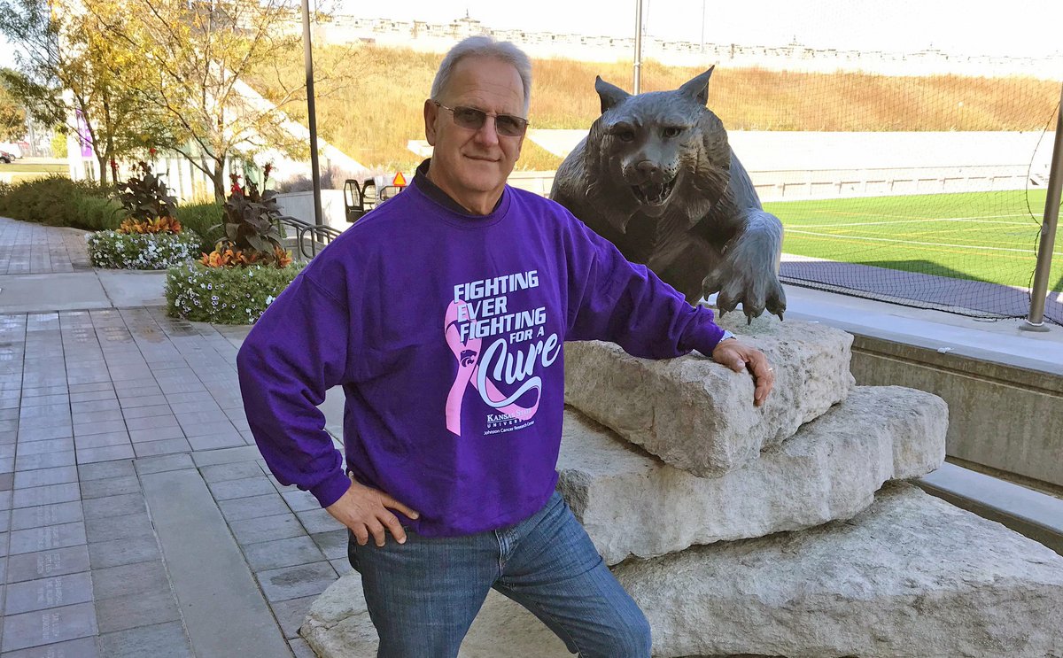 KStateCancerRes's tweet photo. Leader of @KStatePride Marching Band Dr. Frank Tracz shows his support for K-State's fight against cancer! Sweatshirts will be perfect for next weekend's evening game & cooler weather. Get yours for Fighting for a Cure Day Oct 16! #HelpKStateFightCancer https://t.co/i1QHTrx3FY https://t.co/0bhYsg34L7