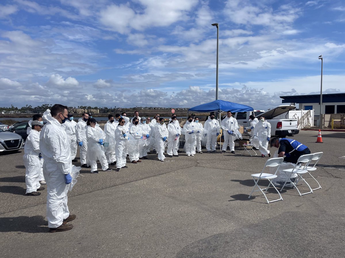 Volunteers participating in a beach cleanup. Assisting with the social oil spill recovery efforts.
