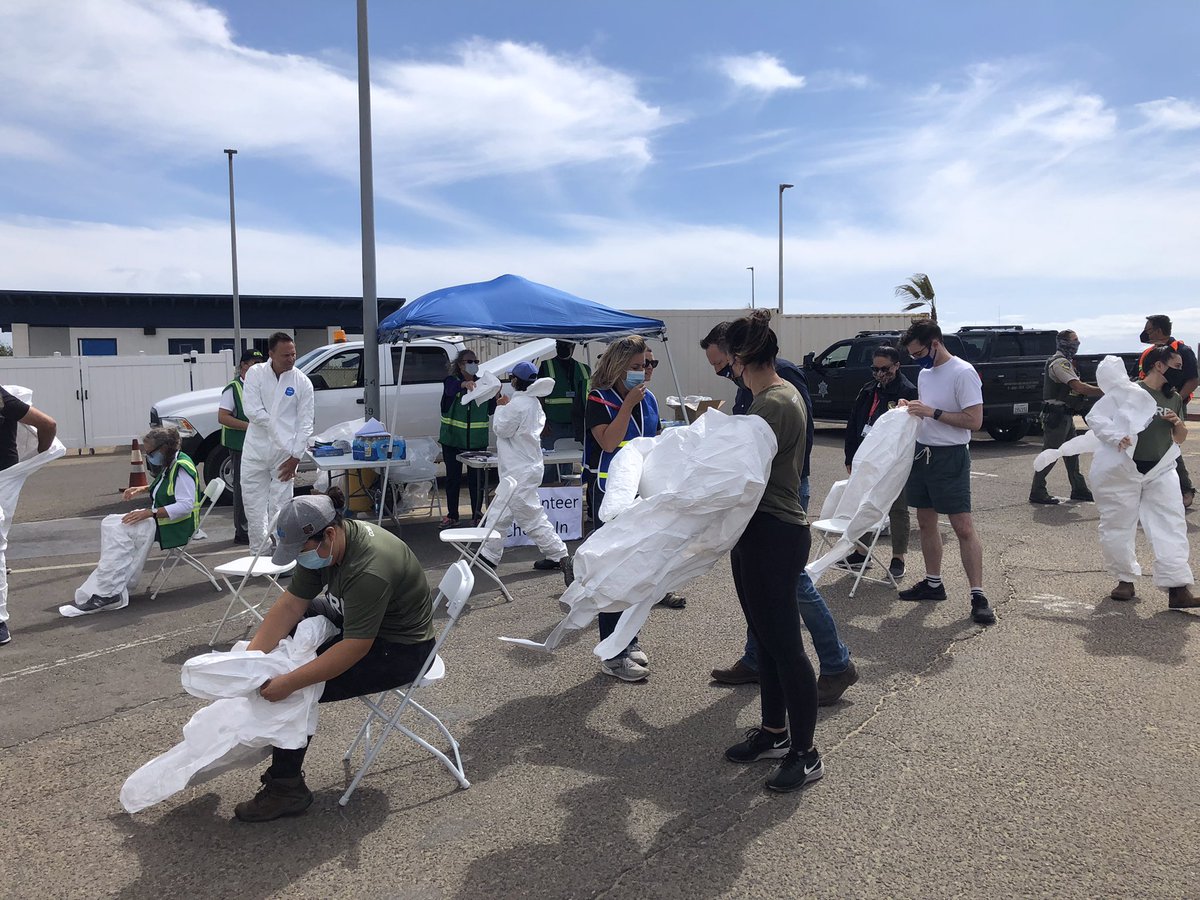 Volunteers participating in a beach cleanup. Assisting with the social oil spill recovery efforts.