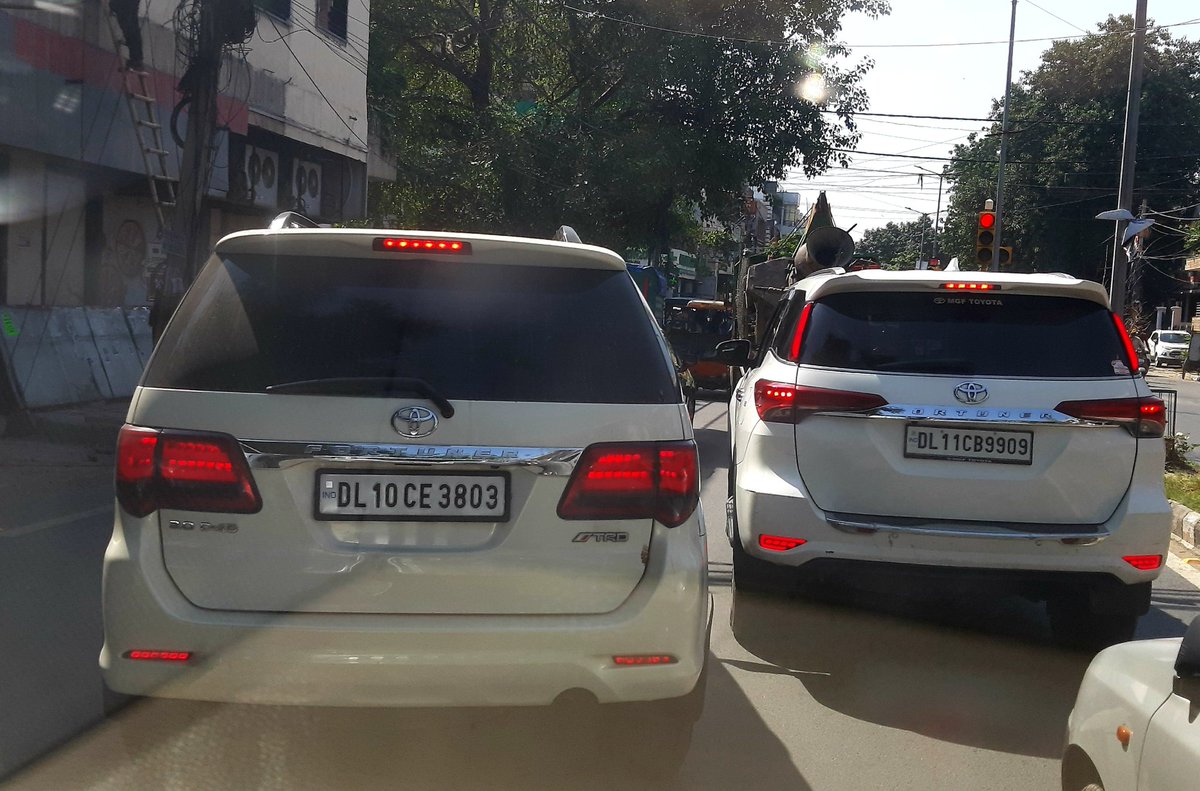 pilotfoundation's tweet photo. @DelhiPolice @dtptraffic both the vehicles using black glass .. at Major Sudesh Kumar Marg, Aggarwal Red Light (1:04 pm 9/10/2021) Rajouri Garden, New Delhi 110027. https://t.co/gWNVkM8qmj