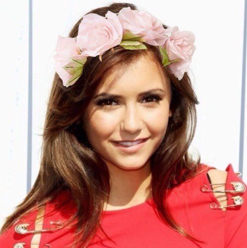 With a flower crown