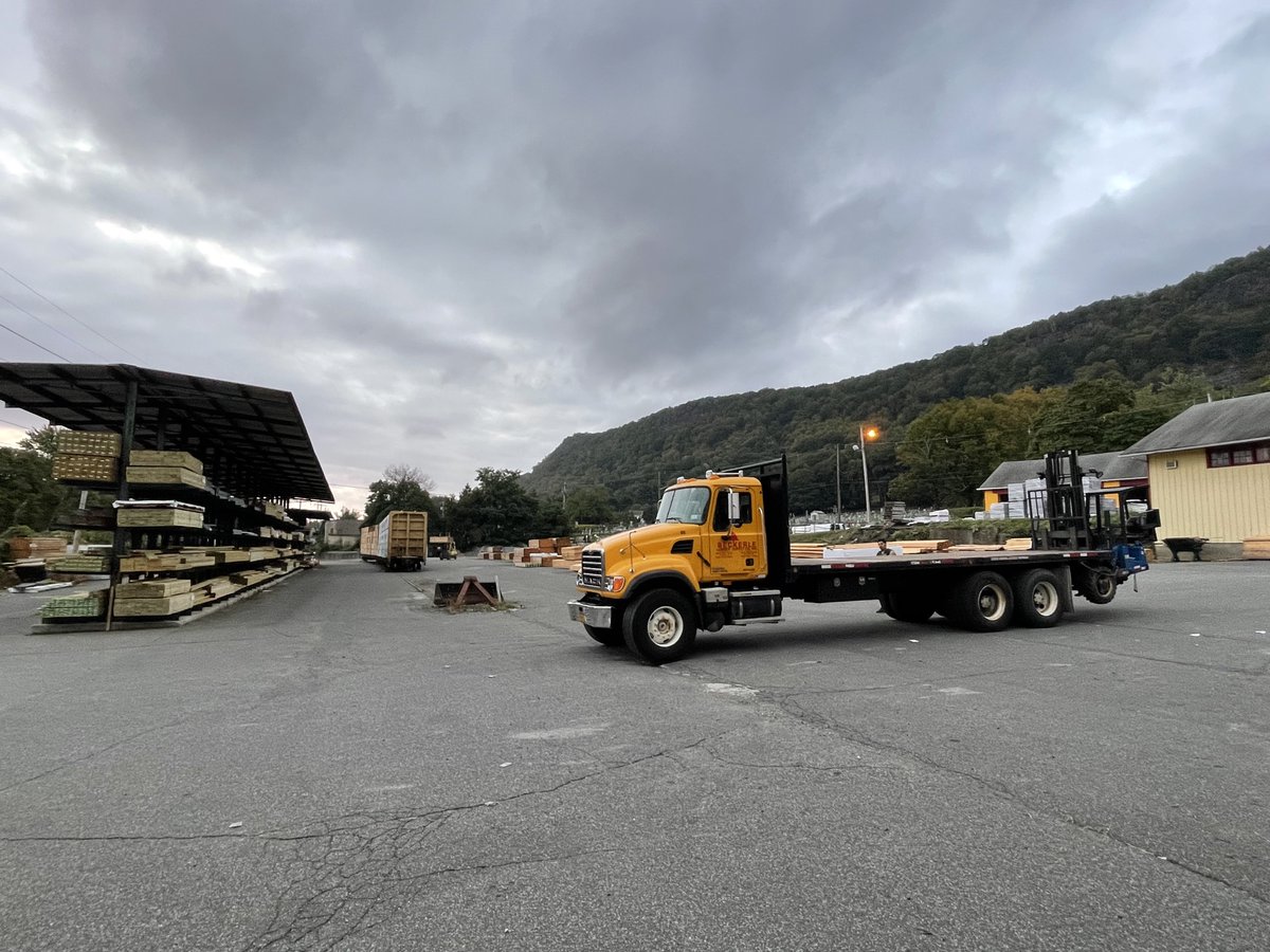 Unloading the two LUMBER rail cars that just arrived DIRECT  from the west coast - talk about efficient...
