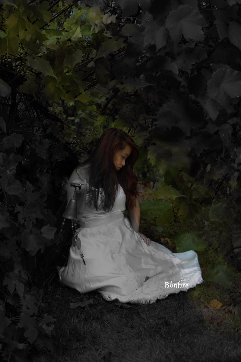 2ManuallyFocus's tweet image. Playing around my backyard with my child. He took this image of me and added more leaves since my grapes are actually thinning for the winter.  I didn’t know how I was going to edit this but I liked how it’s both black and white and color.  #selfie #selfcare