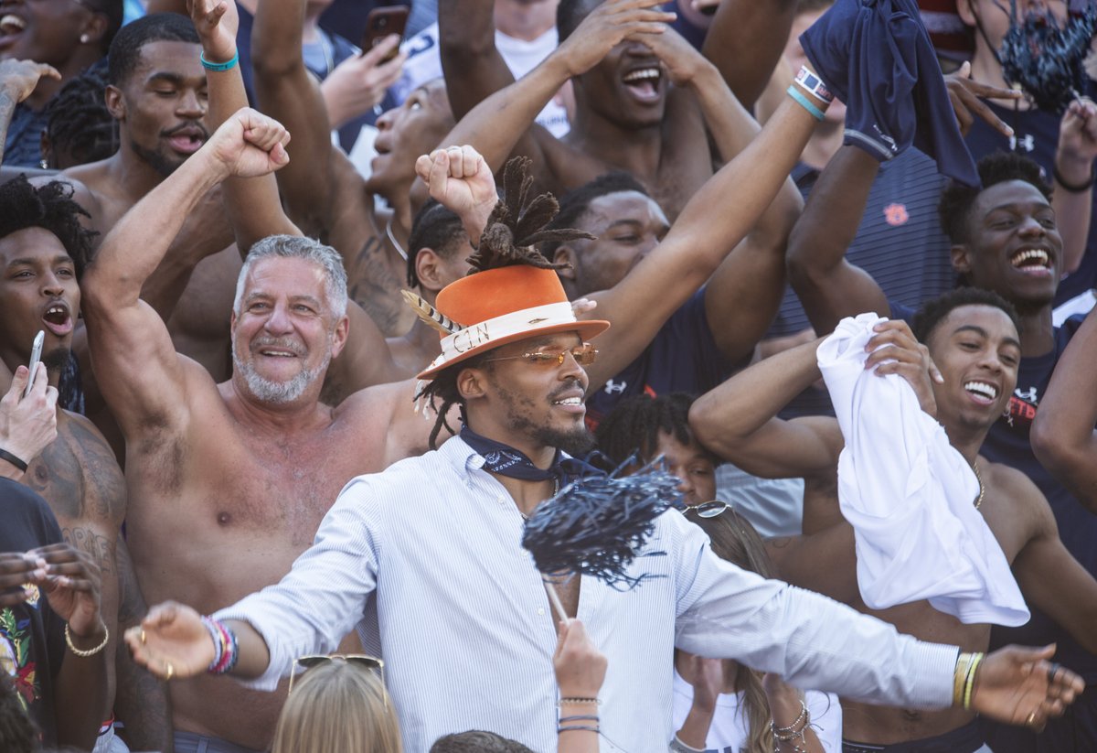 jakevcrandall's tweet photo. Shirtless Bruce Pearl hugging Cam Newton was not something I ever thought I'd see PHOTOS:https://t.co/wRyo6vHIUc https://t.co/7cJlEGkHPt