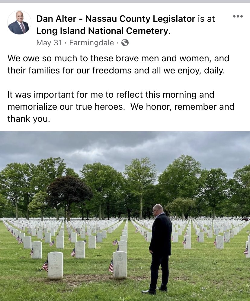 NassauGOPWatch's tweet photo. Why is republican Leg. Candidate Dan Alter posing in front of the grave of  WWI veteran Paul Loeser of Ringoes, NJ? It’s a photo-op! Alter goes to a veterans cemetery to pose for a campaign photo. It’s not even family member or someone he knows. It’s a  random grave. #ghoul https://t.co/x4GutAyAWe