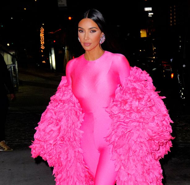 Daily Star on X: Kim Kardashian pours curves into pink Spandex