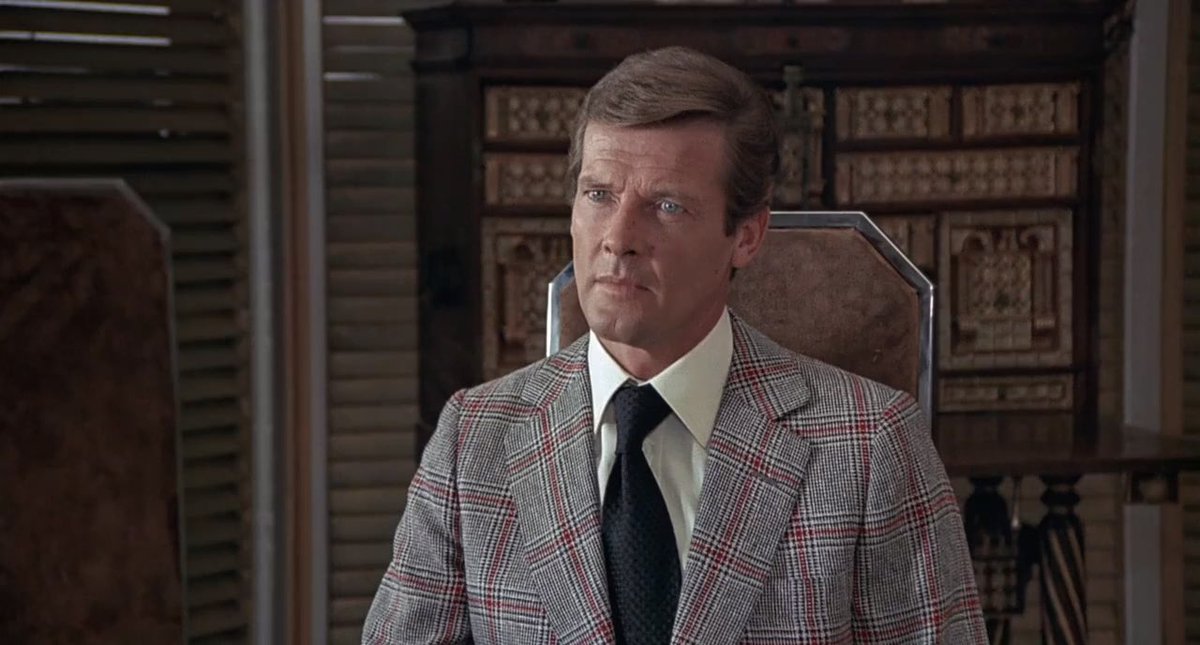 Roger Moore is the sexiest ever in this film. 🥵 and he wears so many amazing outfits. #TheManWithTheGoldenGun