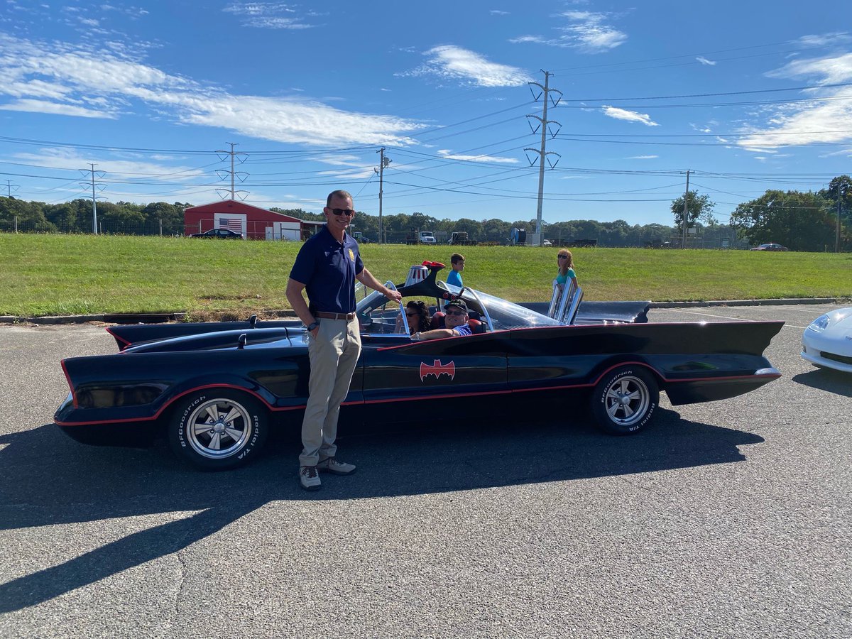 SCPDHq's tweet photo. Is that a bat signal flying over Yaphank?
Sadly no, Batman was not in Suffolk last weekend. However, Acting Commissioner Gordon, I mean Cameron, posed in front of this Batmobile at #SCPDHQ before a local car show. Unfortunately, this vehicle will not be joining our PD fleet. https://t.co/untjZ1kAzv