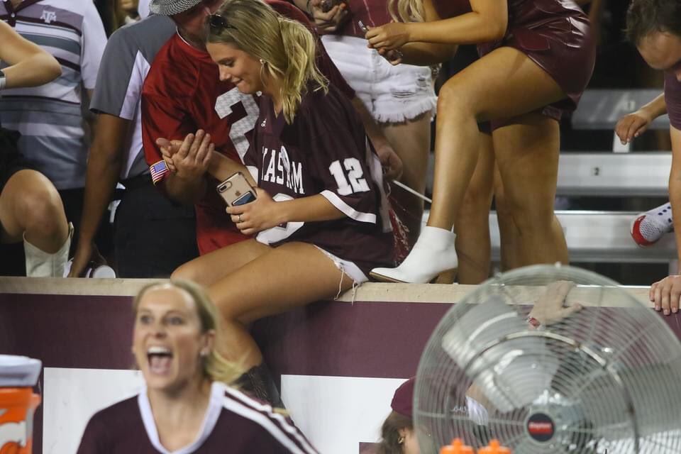 aggiemag's tweet photo. Bama fan helps Aggies safely out of stands and onto the field! https://t.co/szHrSaGxMv