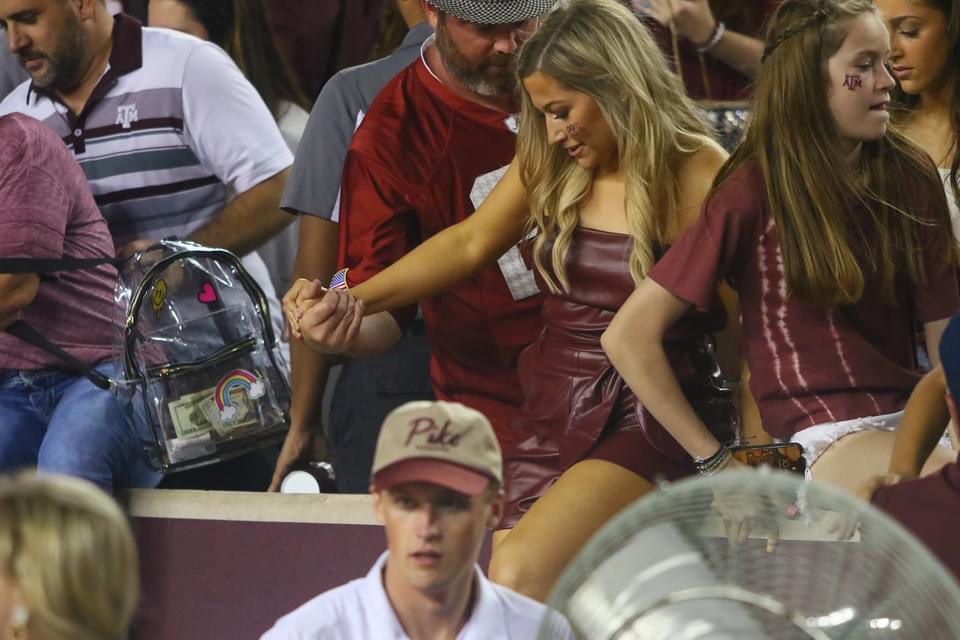 aggiemag's tweet photo. Bama fan helps Aggies safely out of stands and onto the field! https://t.co/szHrSaGxMv