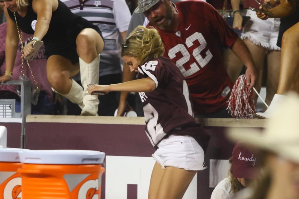 aggiemag's tweet photo. Bama fan helps Aggies safely out of stands and onto the field! https://t.co/szHrSaGxMv