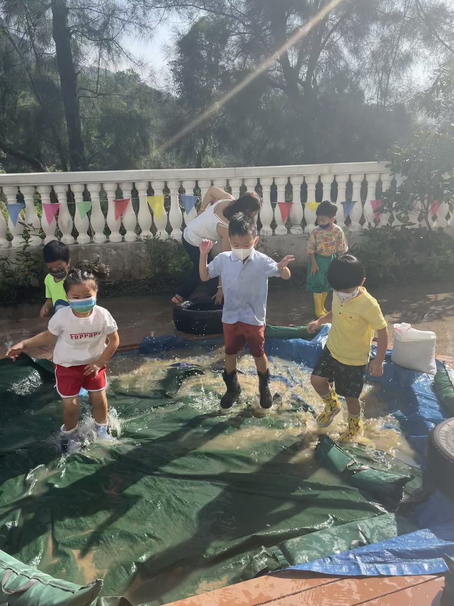 HarrowHKLS's tweet photo. The typhoon may have left a little rain behind but K2 have managed to see the fun side ☔️ #HarrowHK #EYC #puddleparty https://t.co/2wcL0sVu91