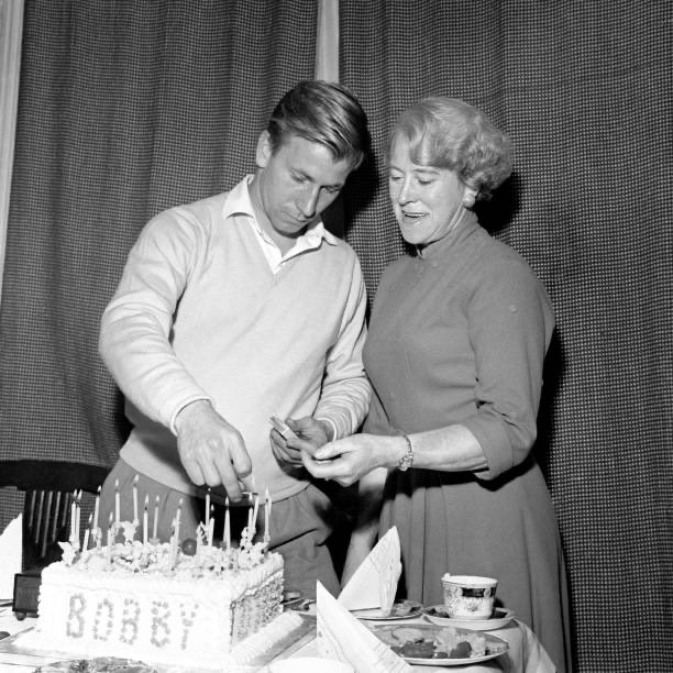 Happy 84th birthday Sir Bobby Charlton.

Here Bobby was 63 years ago with his mother Cissie celebrating his 21st. 