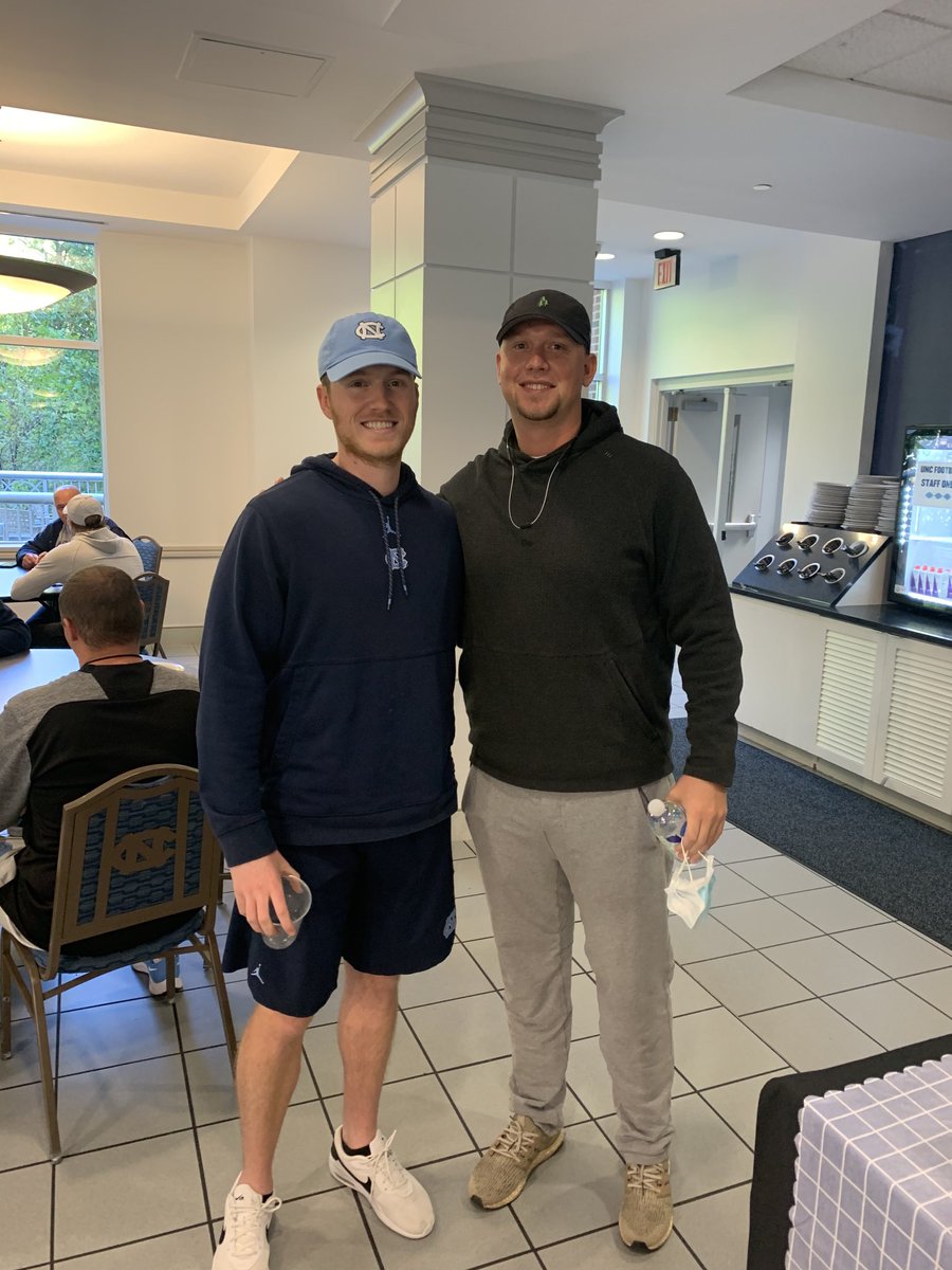 CoachPhilLongo's tweet photo. 🔷🔷🔷Great seeing QB J. Briscoe (2-Time Walter Payton Award Winnner) during his visit to UNC to watch us beat Miami. Awesome seeing him interact with Coach Brown and our QB’s here at UNC. #FamilyNFootball #TarHeelNation #QBUnited #57TDPasses #CarolinaFootball #BeTheOne https://t.co/X4ccfOqRRs