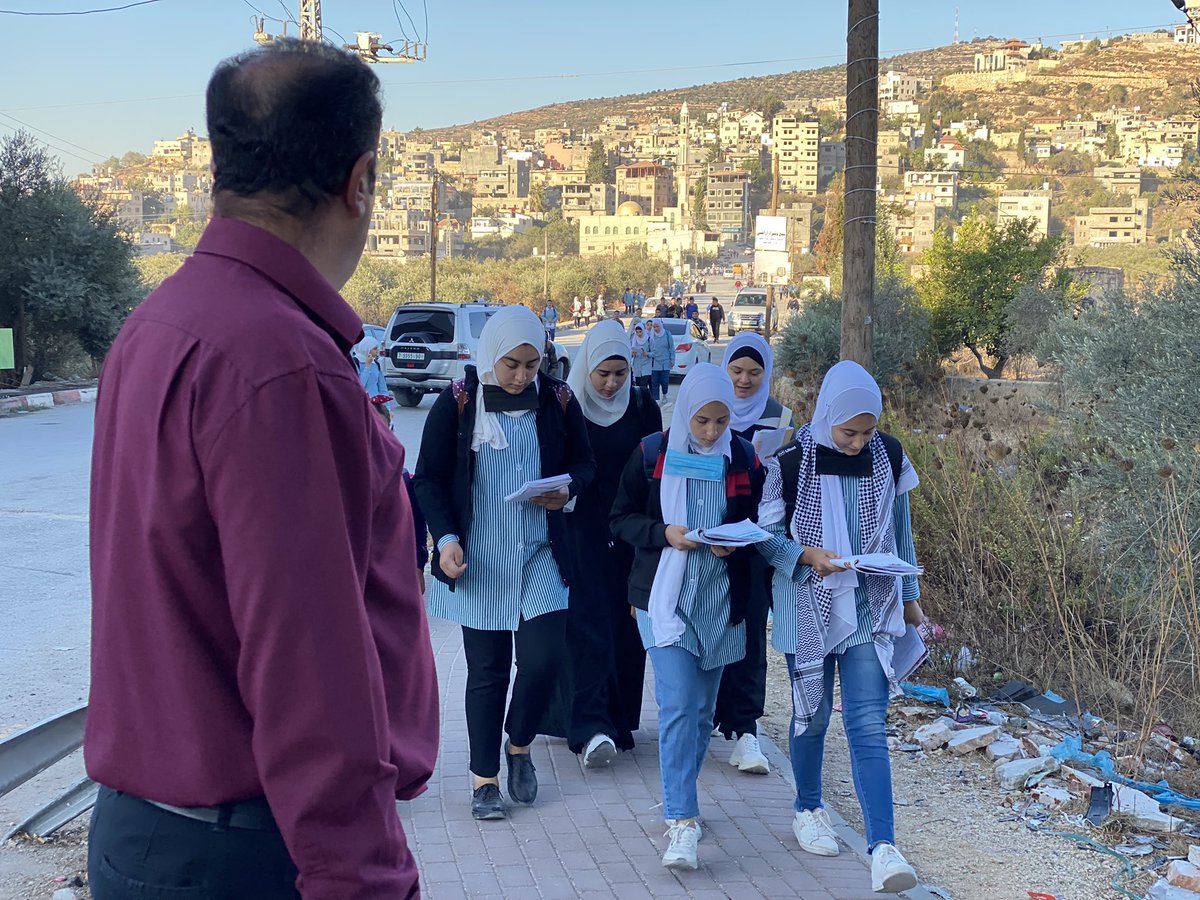 AlaaDaraghme's tweet photo. Students of Libban Al Sharqyeh school heading to their school surrounding by their teachers due to the tension around the school as Israeli soldiers have been preventing students from using the road leading to their school.
The army says students throw stones on settlers vehicles https://t.co/V2SNsy830o