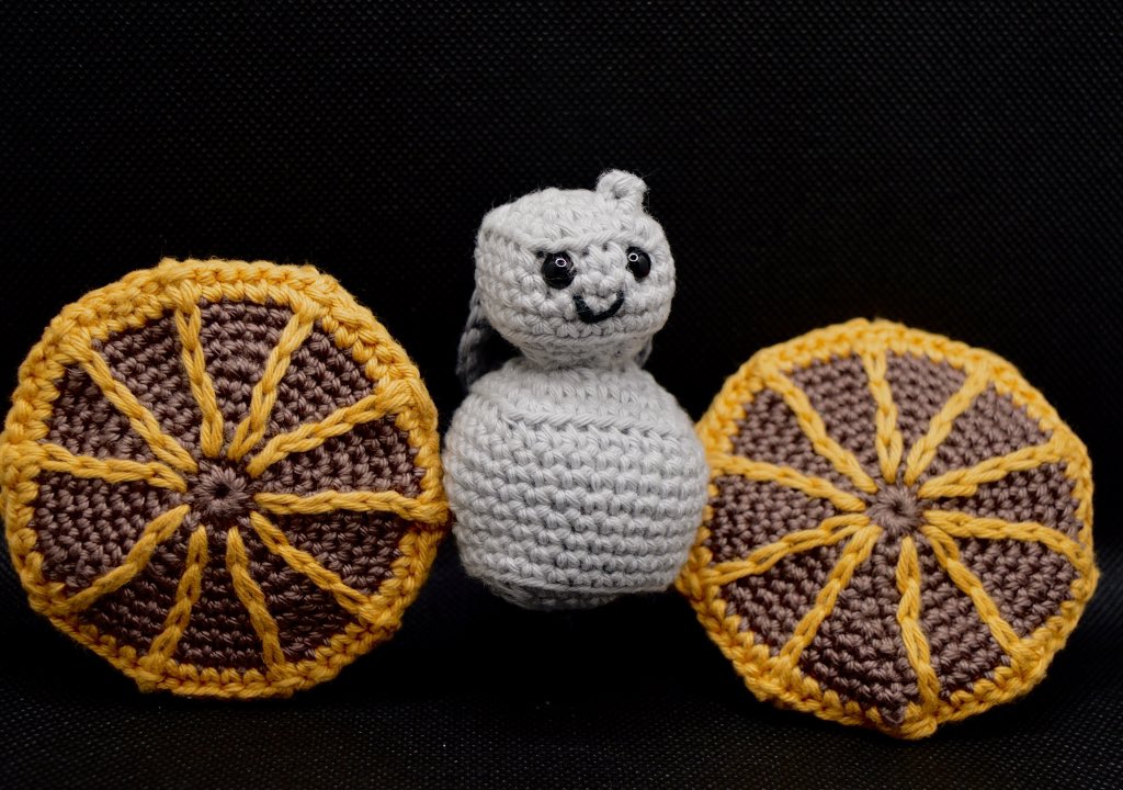 Crochet Lucy spacecraft with a big smile