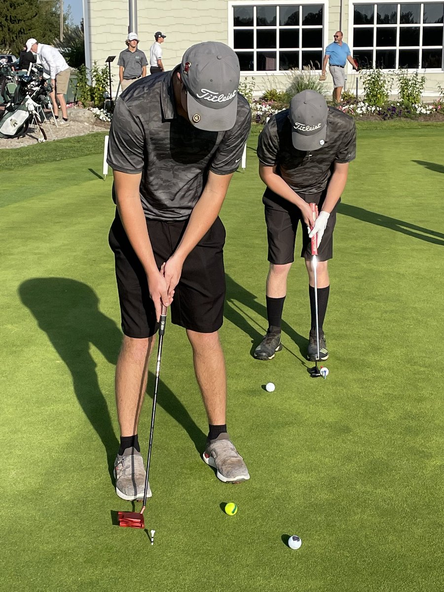 Booth leading off the Eagles at districts while Anderson and Metz warm up. Great day to be at the golf course!!