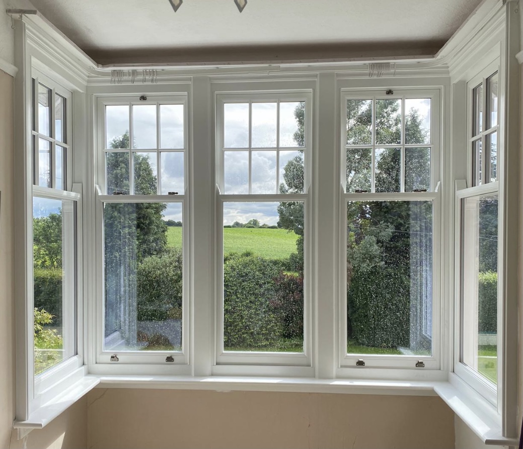 Our concealed balance sliding sash accoya windows in this stunning bay window.  #patchettproject #windowwoman #renovation #restoration #accoya #timberwindows #slidingsash #sashwindows #baywindow