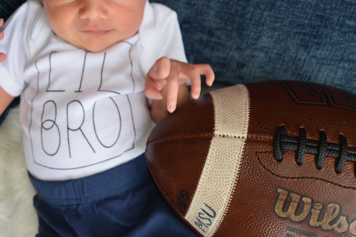 beccsand's tweet photo. Our boy of Fall 💙 Little man received his first game ball at just two days old 🏈 Presented to Dadda after their home win over EIU on 10/2 🥰 https://t.co/O4z0sVCJJm