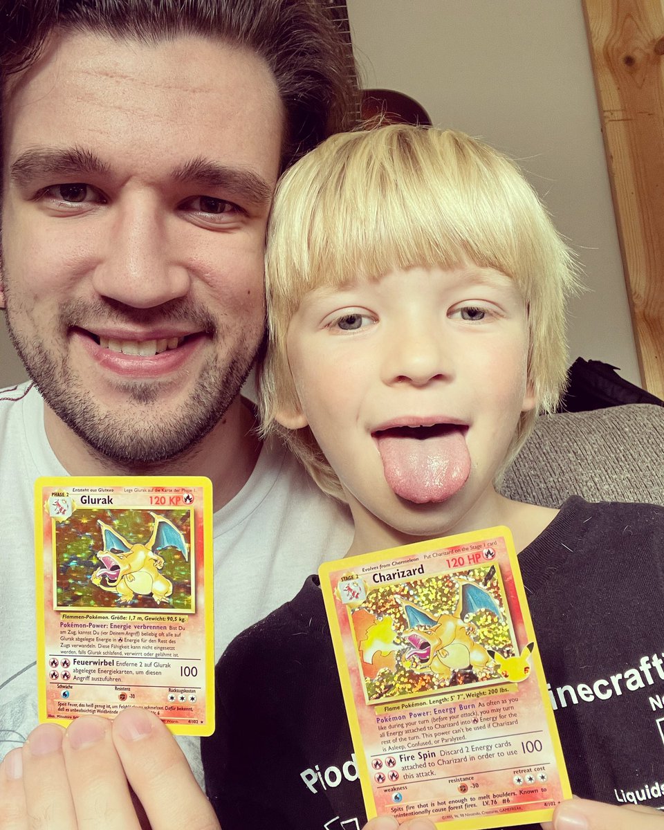 Drdotts's tweet photo. Me with my 25 year old holographic Charizard and my son with his 25 year celebration Holographic Charizard #Pokemon #PokemonCelebrations #25yearsofpokemon https://t.co/TbhxEuEehE