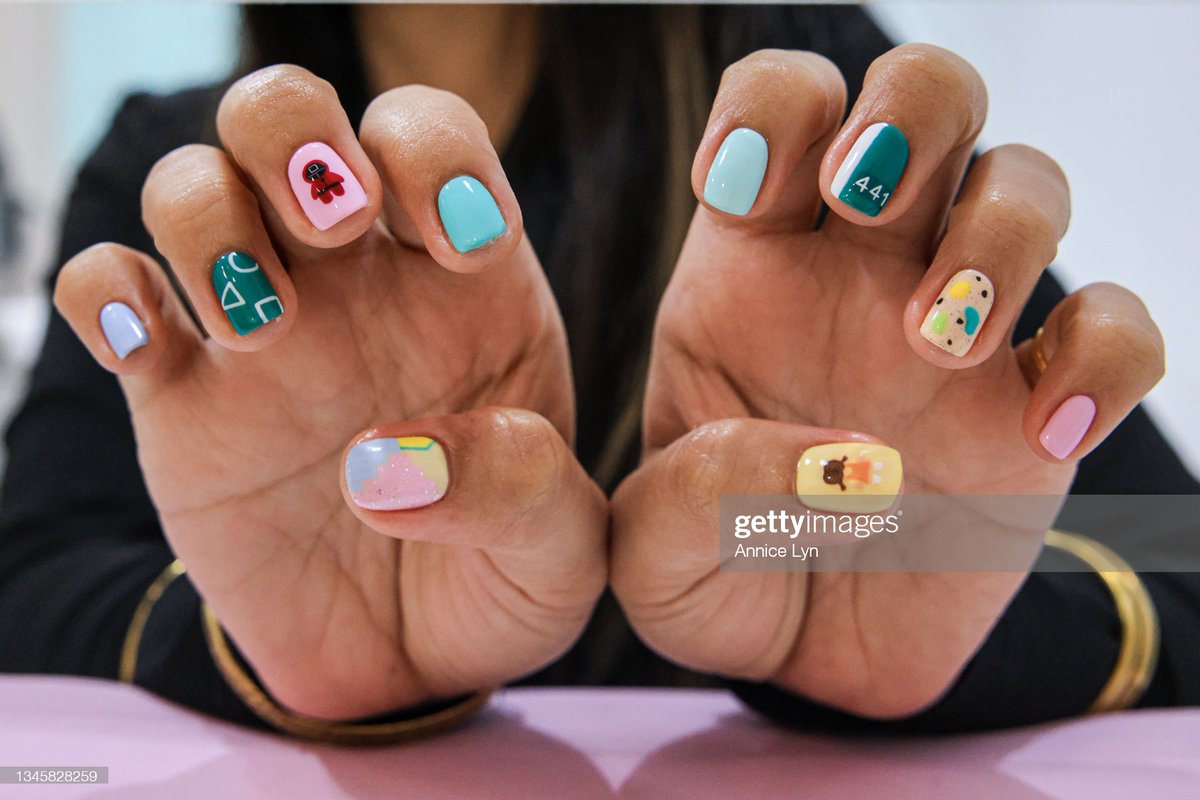 GettyVIP's tweet photo. A "Squid Game" inspired manicure is seen at Maniqure Nail Salon in Sri Petaling, Kuala Lumpur, Malaysia. Customers are invited to play a game at the end of the treatment, and if they win, they can walk away without paying.

More 📸 #SquidGame 👉 https://t.co/ilhsFi8YUt https://t.co/qRMemeq5xN
