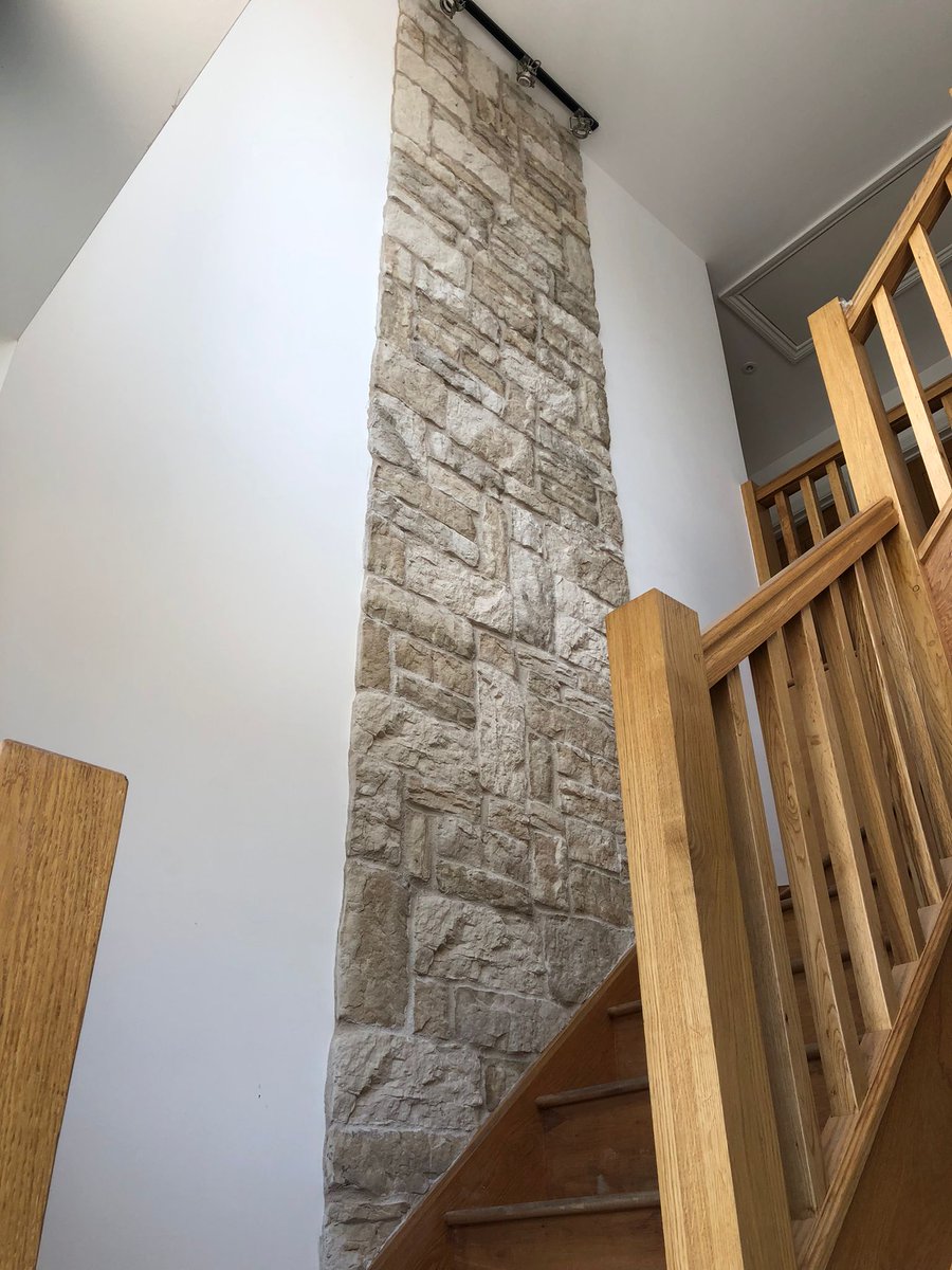 Our precast Haven Buff stone slips used in a Hallway. higginscladding.co.uk #hallway #walldecor