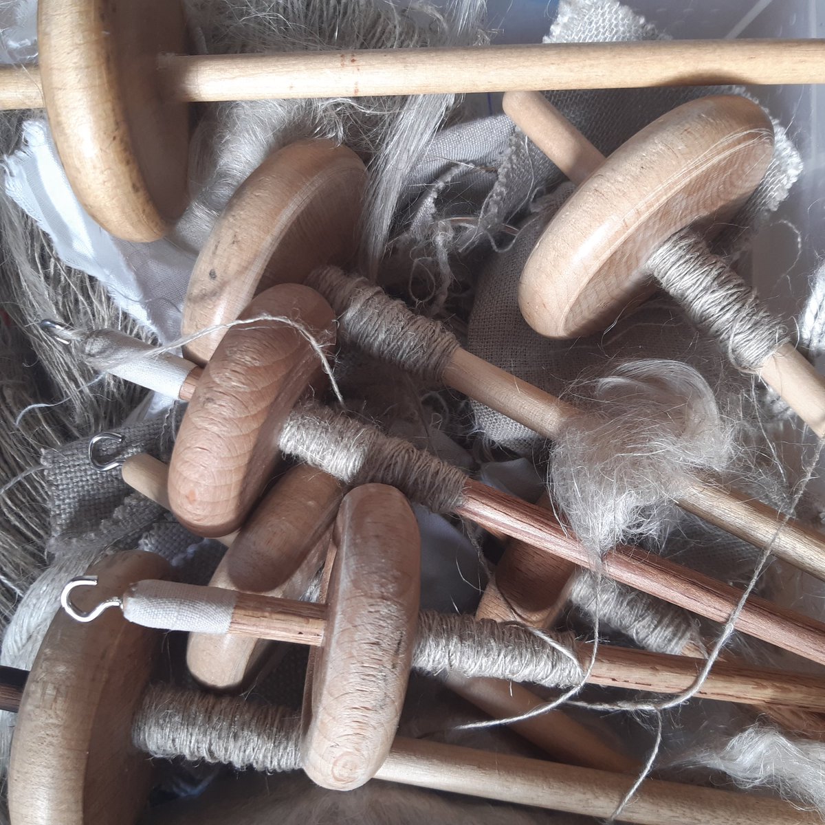 Preparing the spindles for a new set of primary school children, with flax and drop spinning, I've  missed  it @Cass_Liversidge