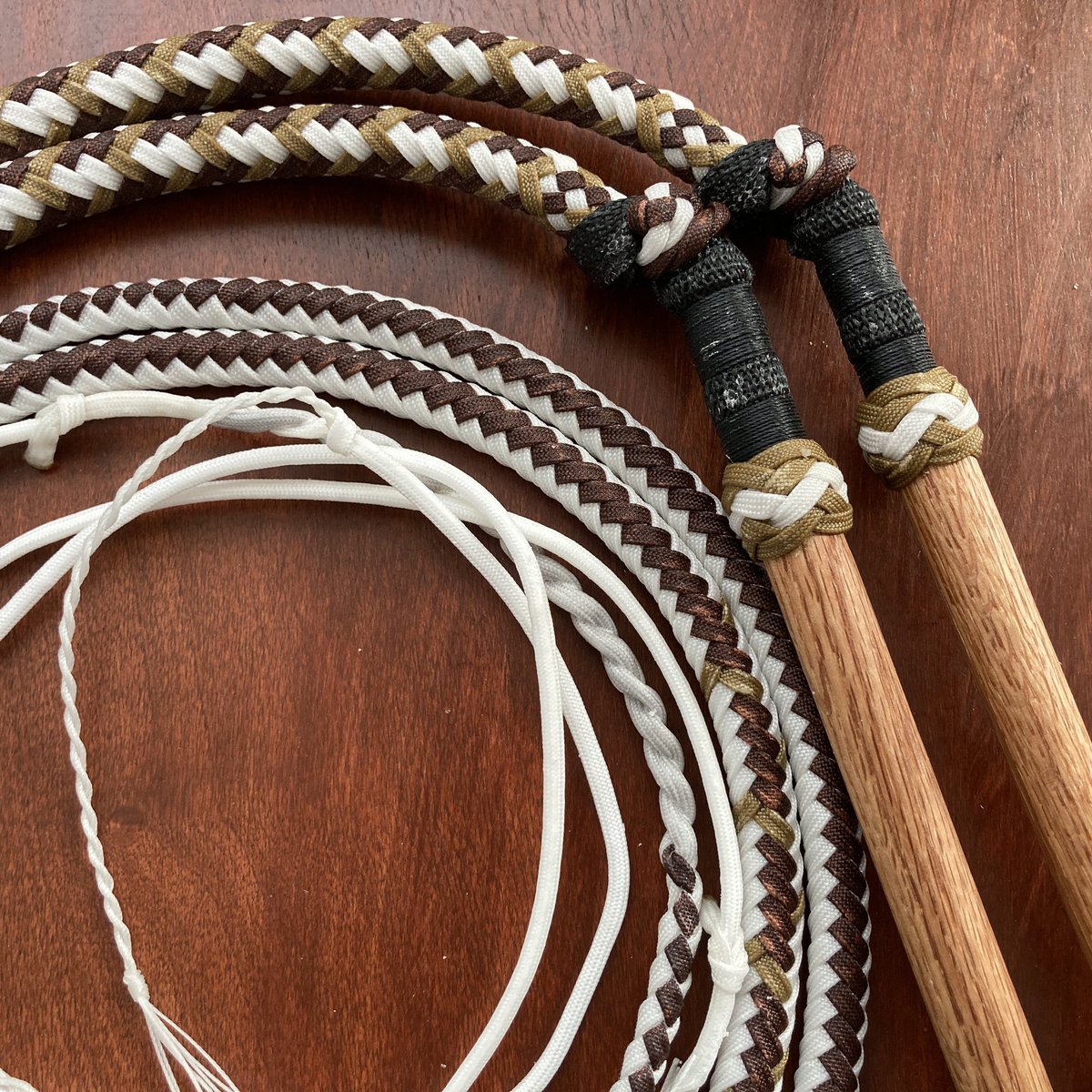A matched pair of half plait Signature Nylon Stock Whips in white, brown, and tan. 
These were made to match a performing outfit, which is always a fun challenge
.
.
#whip #whips #nylonwhips #signaturenylonstockwhips #whipcracking #torrancefisher #swordguybuilds #sgb