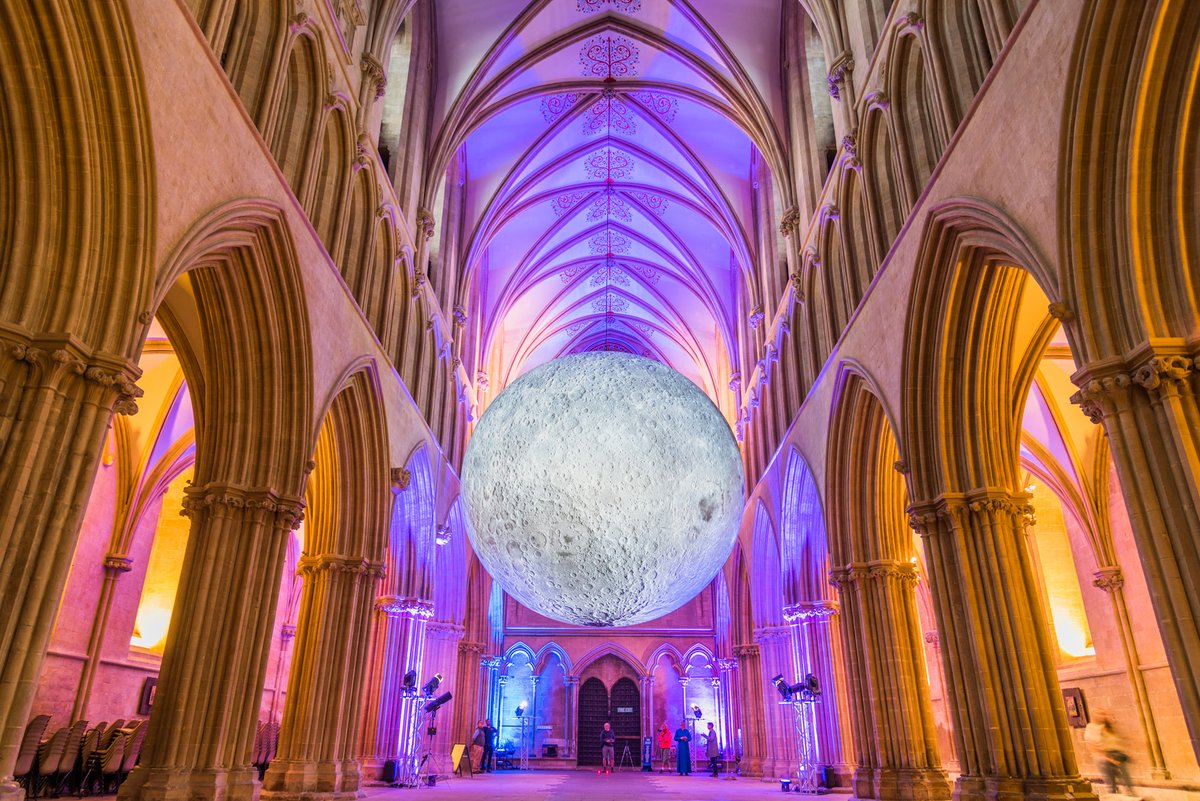 gerrylynch's tweet photo. They are currently celebrating the #WellsFestivaloftheMoon in the Cathedral. This is what the big orb looked like after Evensong when they were having a bit of fun with different light colours. #OThouTheCentralOrb #SWMoonLanding 11/12 https://t.co/ZdO6DeahiW