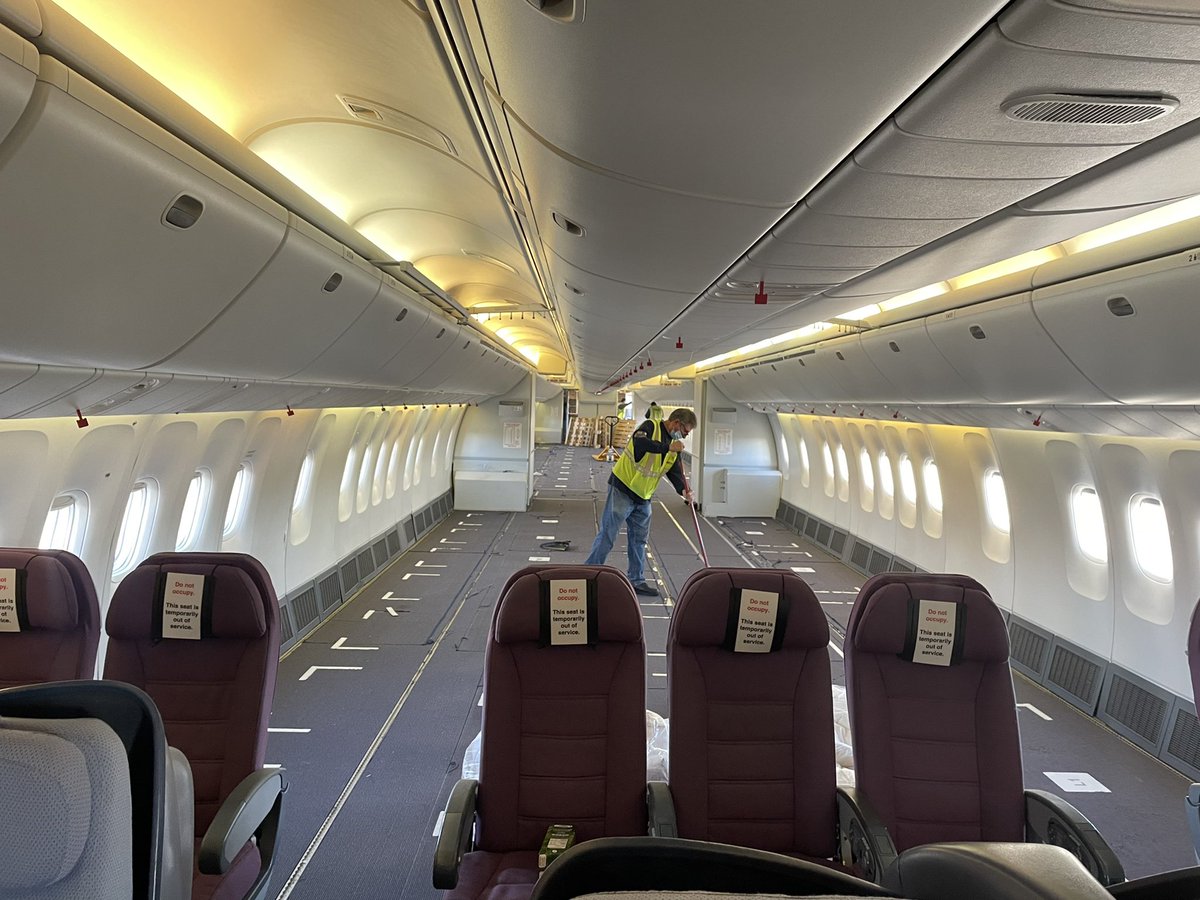 SteveNomadic's tweet photo. CC-CXE, which is in the PAX configuration (sort of) has been running as a cabin freighter during Covid-times awaiting its conversion slot. The guys are sweeping it up and cleaning it out for us prior to departure. https://t.co/uBzF77GgSz