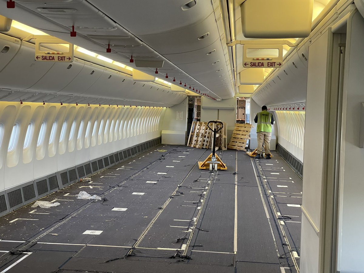 SteveNomadic's tweet photo. CC-CXE, which is in the PAX configuration (sort of) has been running as a cabin freighter during Covid-times awaiting its conversion slot. The guys are sweeping it up and cleaning it out for us prior to departure. https://t.co/uBzF77GgSz