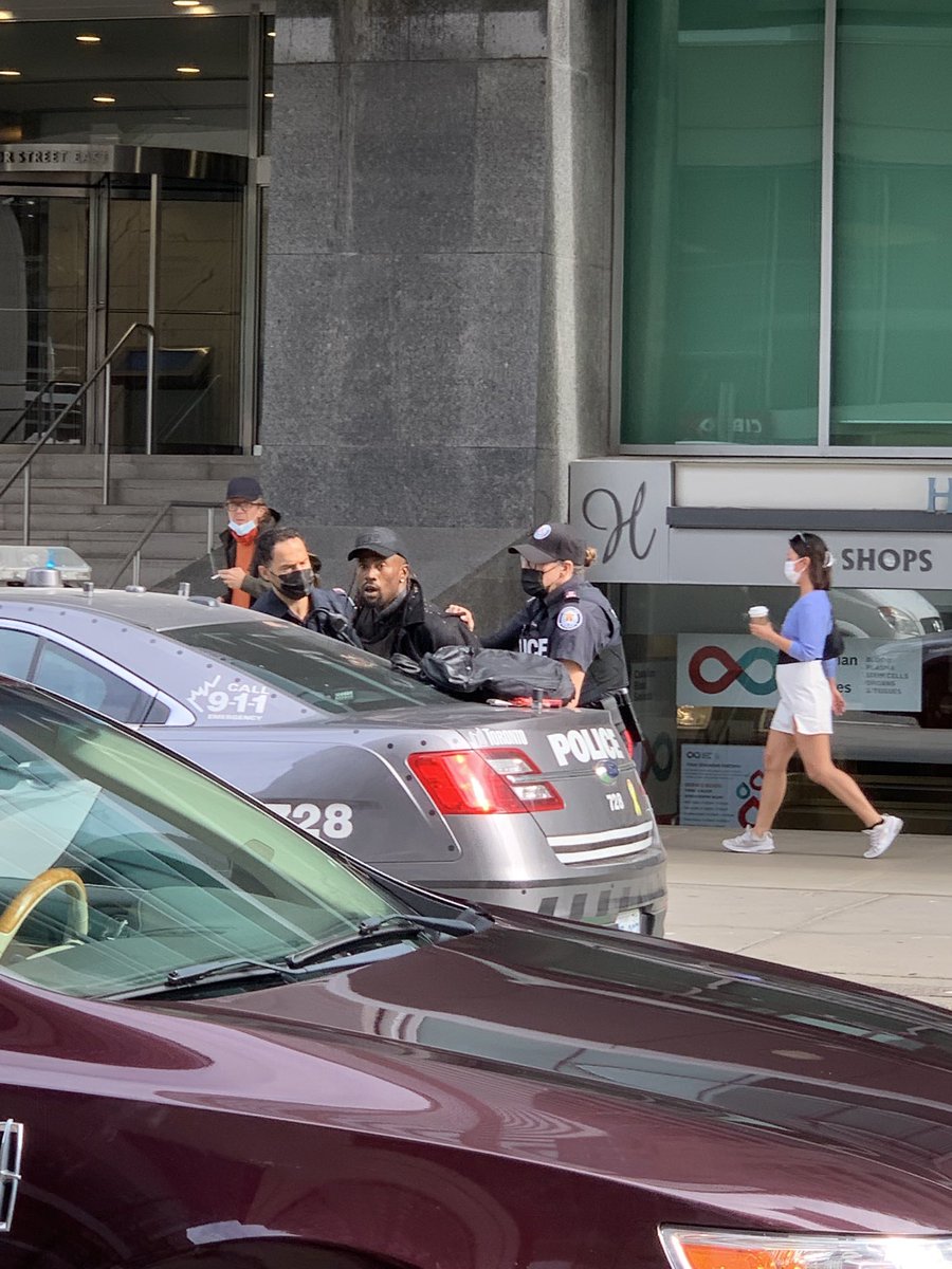 Right now this guy is being arrested - asking for help. Says his backpack has been cut. Says they have his ID .