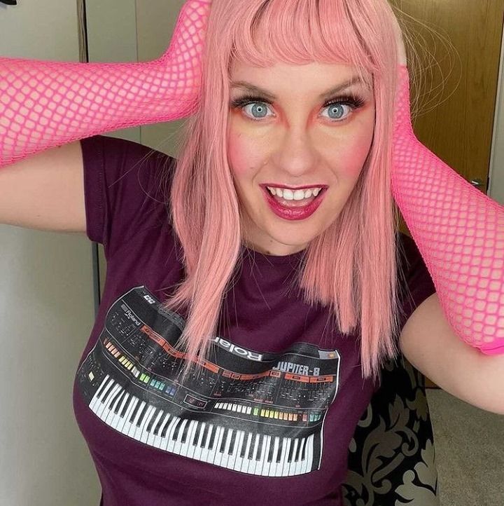 nerditystore's tweet photo. @lorena_f rocking our classic #RolandJupiter8 synth design. The 80's pink vibe is just perfect and I love this shot! Dive on over to our store to order yours today. #organicclothing #sustainablefashion #synthlover #gamergirlsofinstagram #musicgear #synthtee #musicmerch https://t.co/FpLsx7Uh4B