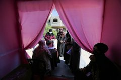 Mvoice13's tweet photo. #Palestinian women wait outside a mobile breast cancer check-up clinic set up in a truck, during a campaign aimed to raise public awareness in #Gaza over the need for early tests to discover breast cancer, in Khan Yunis in southern #Gaza. @Mvoice13 https://t.co/uVloYb64Z4