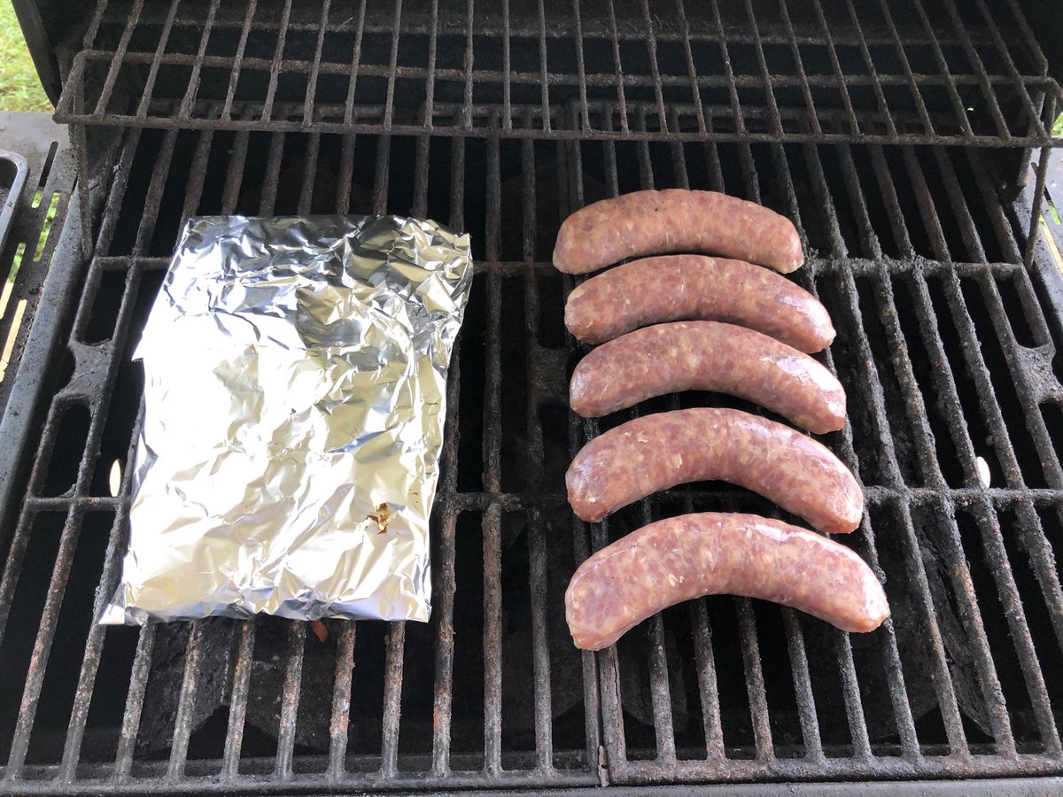 yardsaleartist's tweet photo. Bratwurst on the grill tonight. 

What’s in the foil packet? Bacon-layered sauerkraut, of course!

#GermanDinner https://t.co/Z9K1MaU43e